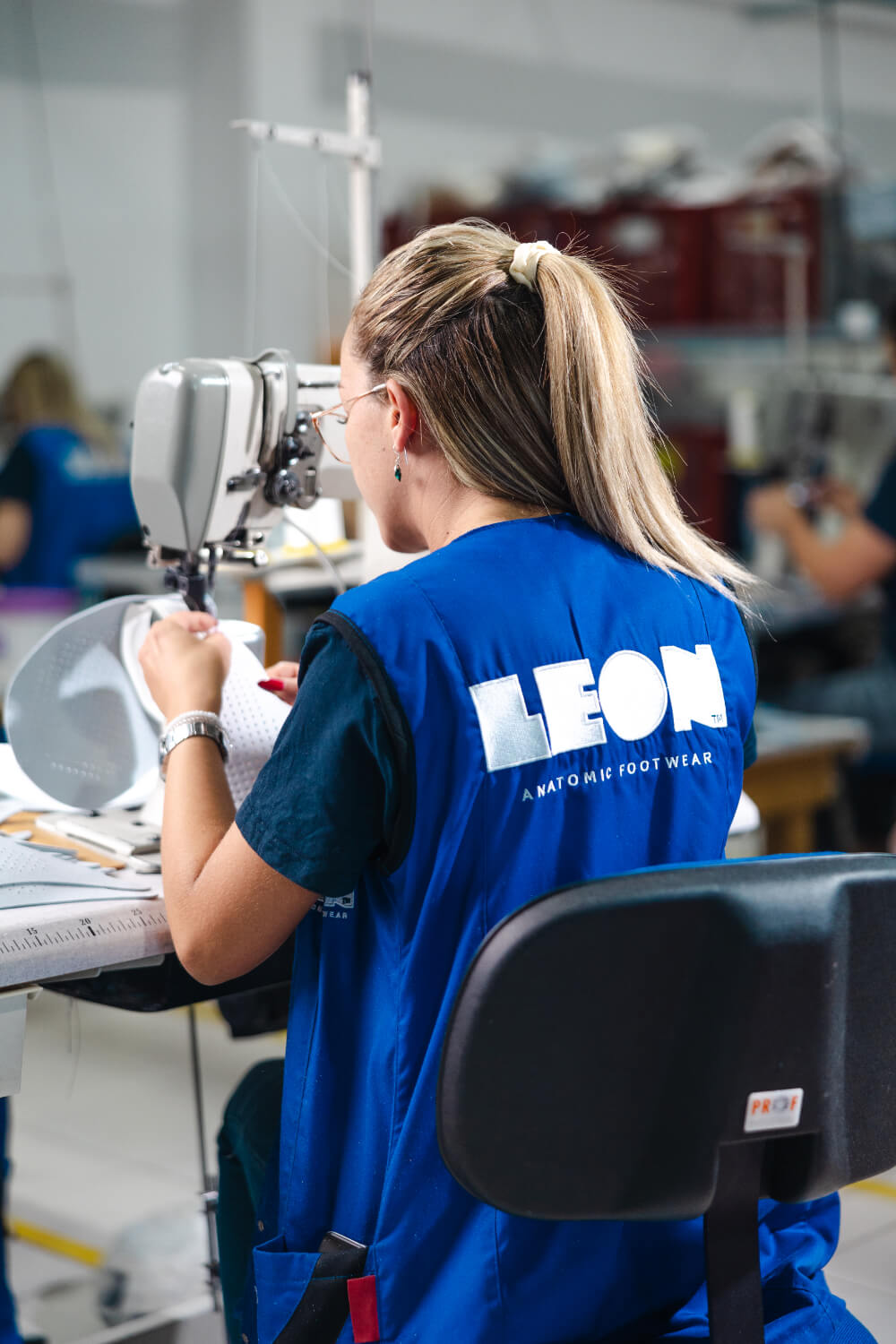 LEON craftsperson sewing leather upper