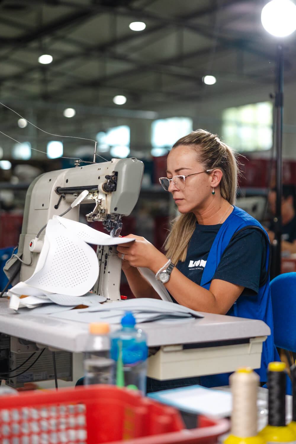 LEON craftswoman sewing leather